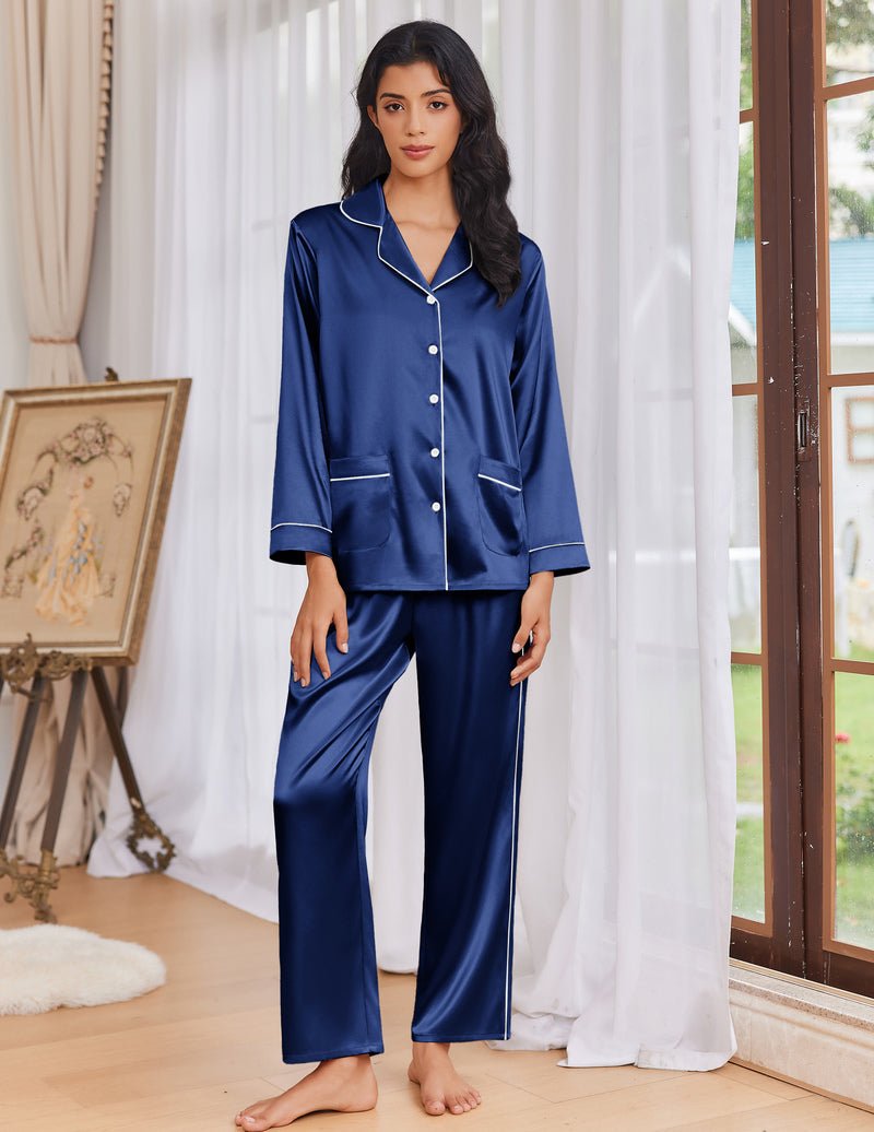 Navy blue satin pajama set with button-front top, patch pockets, and wide-leg pants
