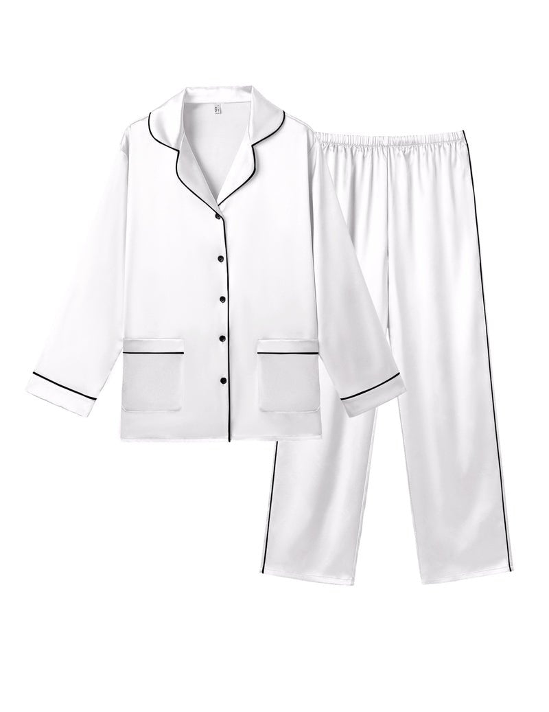 White satin pajama set flat lay: button-front top with pockets and matching long pants