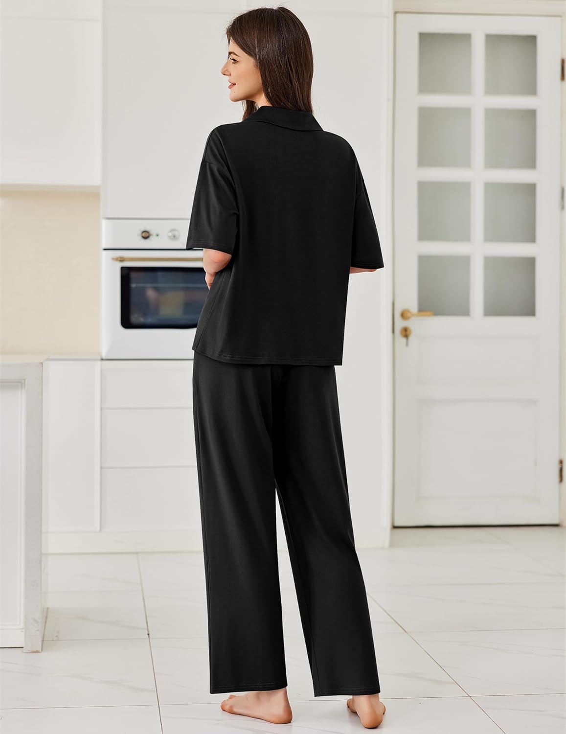 Button-down pajama set in black: short-sleeve collared top and matching long pants (back view)