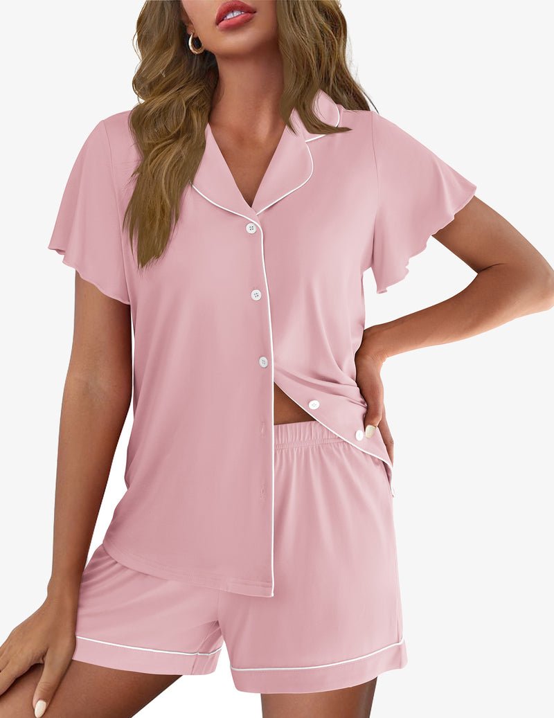 Light pink button-up pajama top with white piping and matching shorts