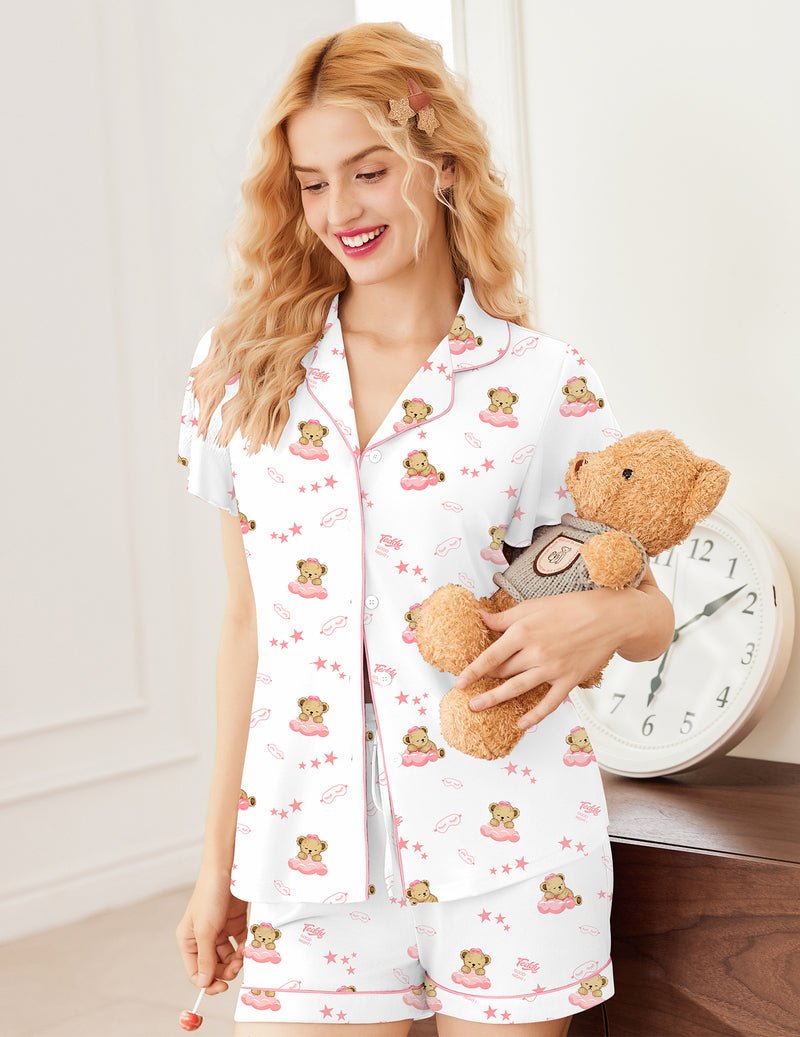White pajama set with button-up top and pink teddy print shorts