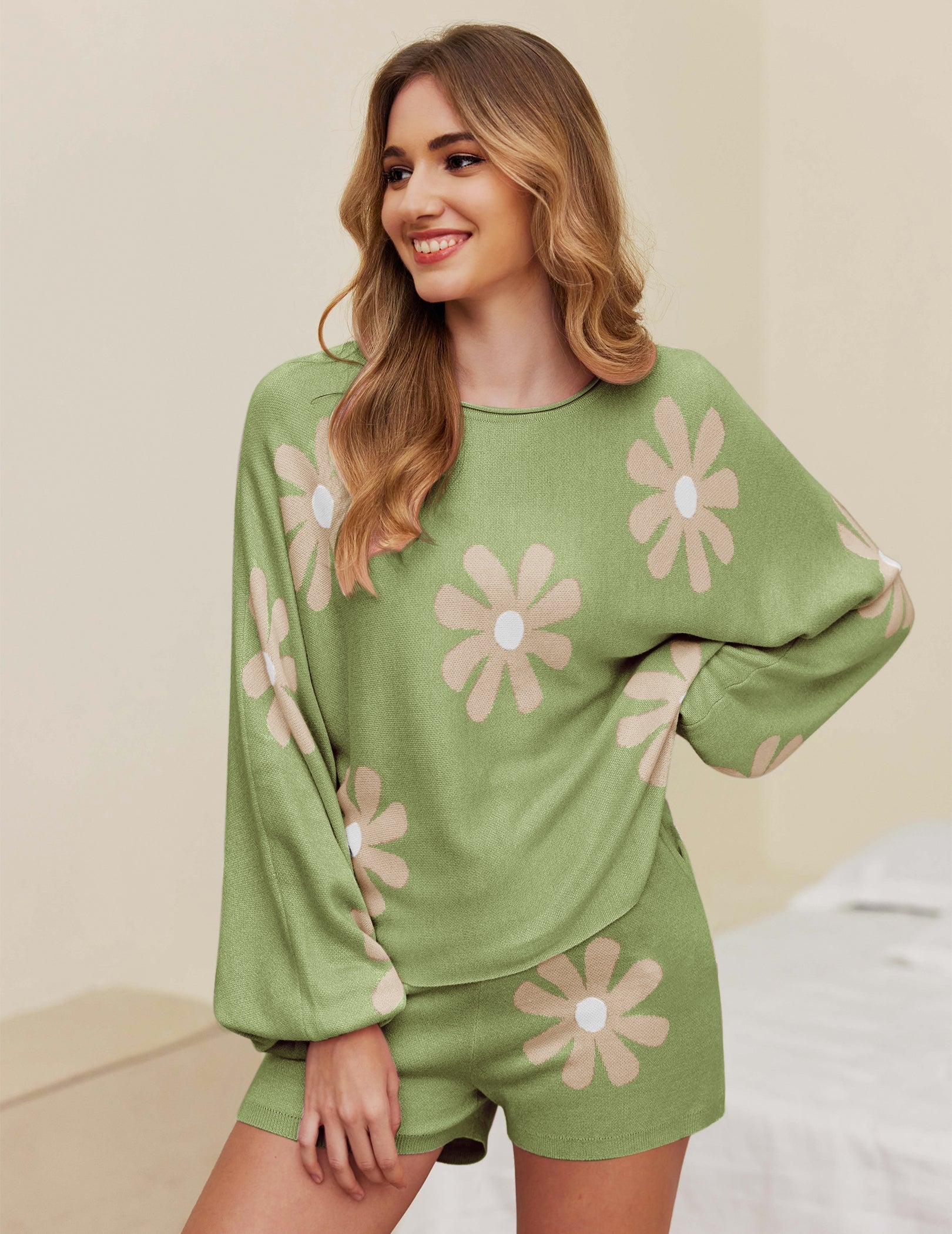 Green pajama set with large white daisy print, long sleeve top and matching shorts