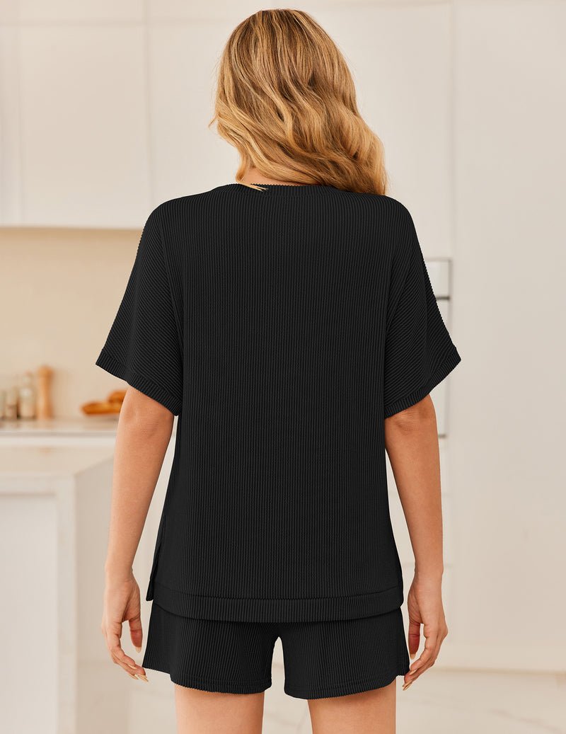 Back view: ribbed 2-piece lounge set with short-sleeve top and shorts, black