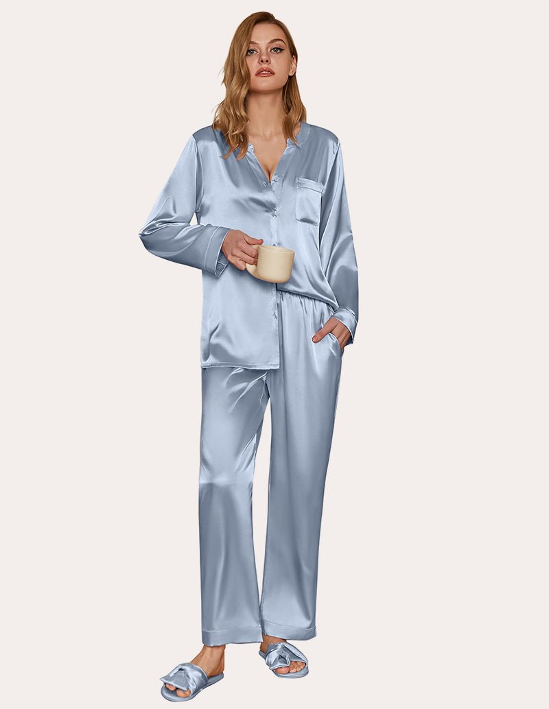Blue satin pajama set with long sleeves and button-down top, matching wide-leg pants