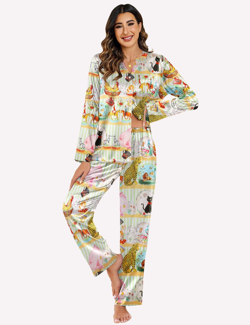 White pajama set with colorful animal-and-cookie print, long sleeves and matching pants