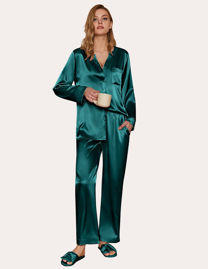 Green satin pajama set with long sleeves and button-down top, matching pants