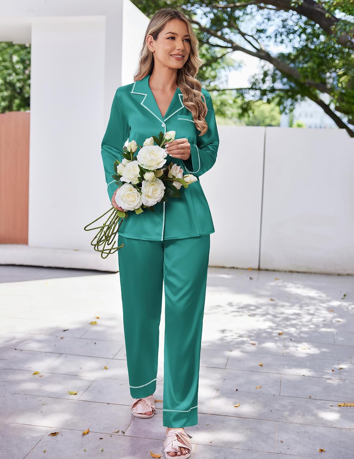 Satin pajama set in emerald green with white piping, button-up top and long pants