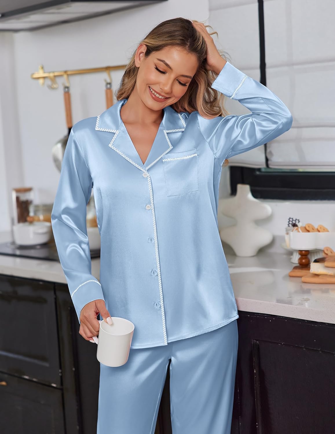 Satin pajama set in light blue, long-sleeve button-up top with piping and matching pants