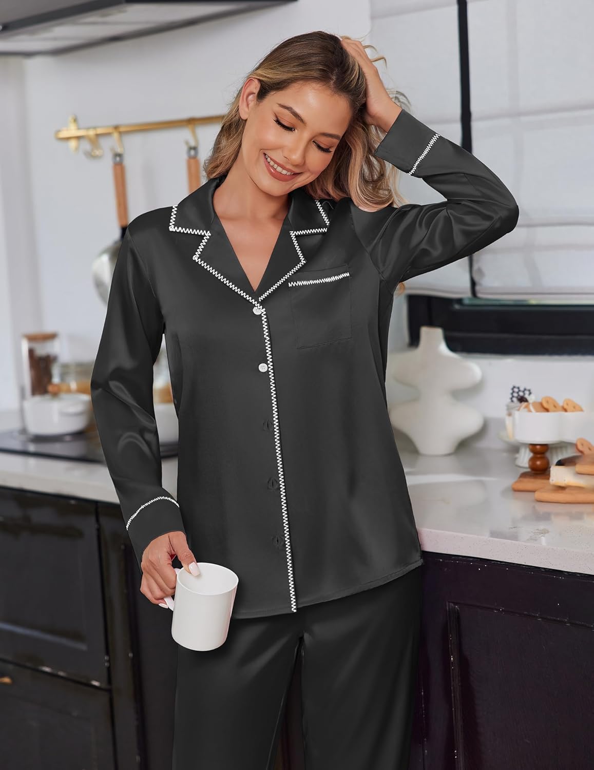Black satin pajama set with contrast trim, button-front top and matching long pants
