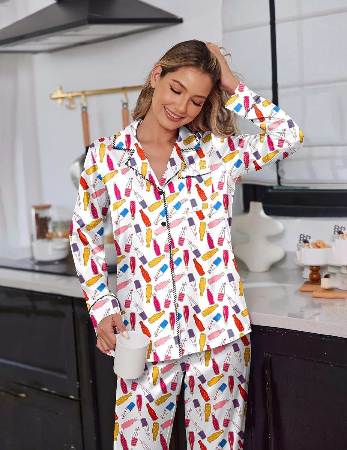 White satin pajama set with colorful popsicle print, long-sleeve button-up top and pants