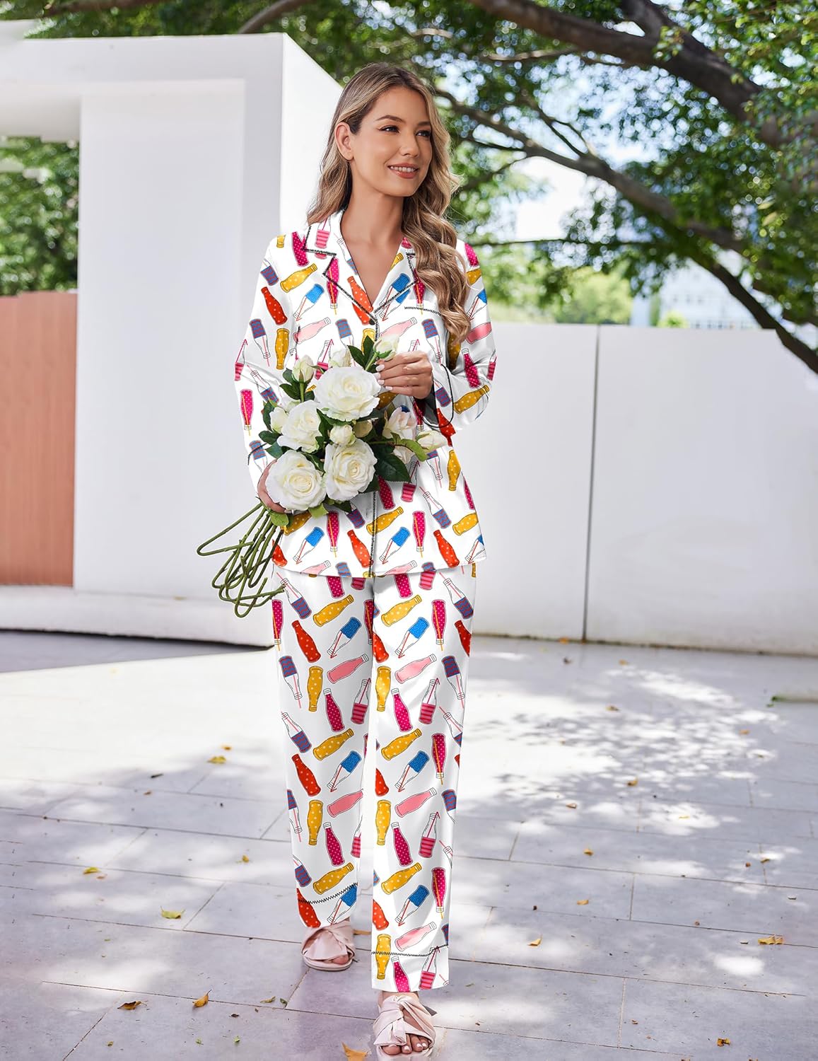 Satin pajama set in white with colorful snack print, button-up top and long matching pants
