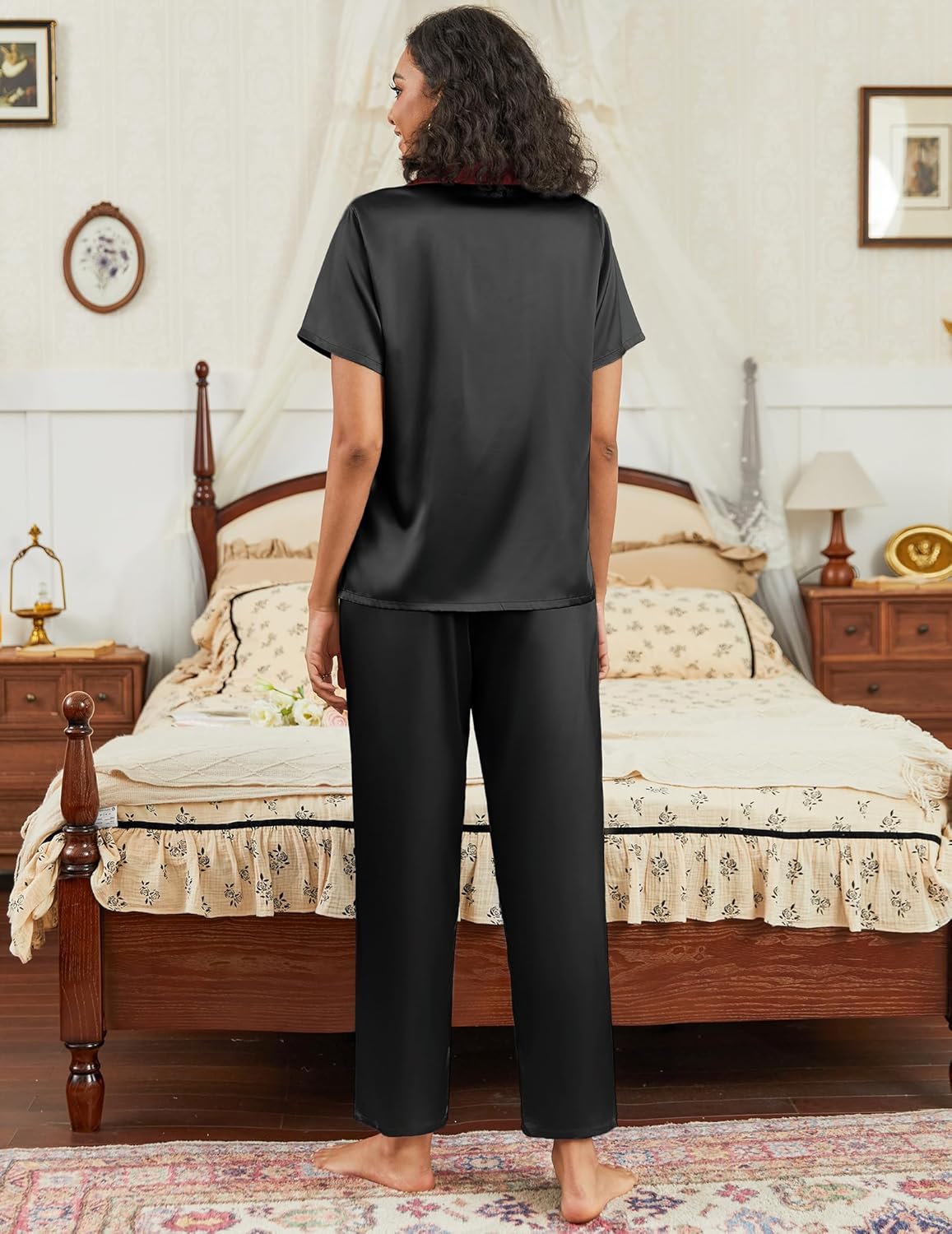 Satin pajama set in dark black: back view of short-sleeve button top and wide-leg pants.