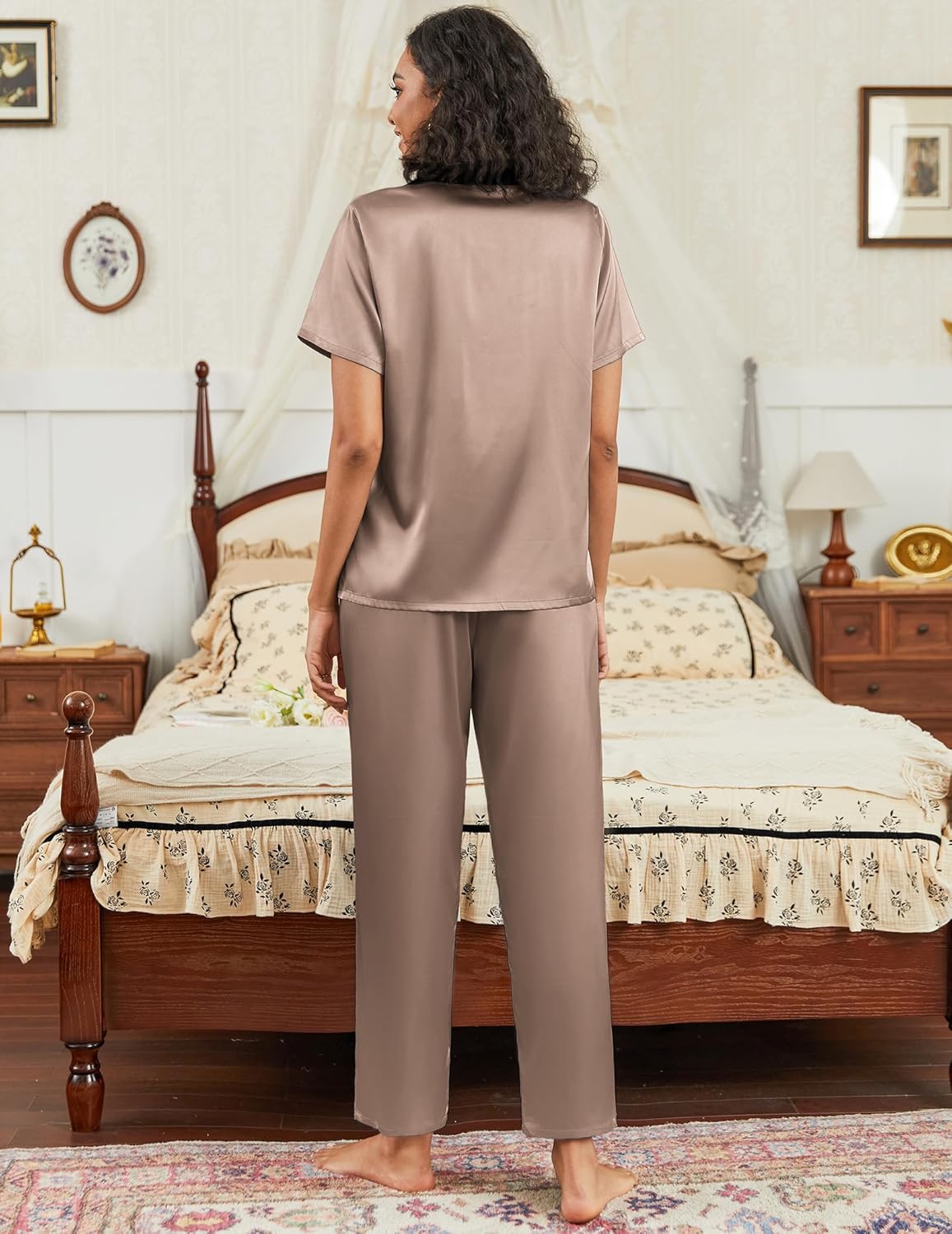 Satin pajama set in light pink: back view of short-sleeve button top with wide-leg pants.