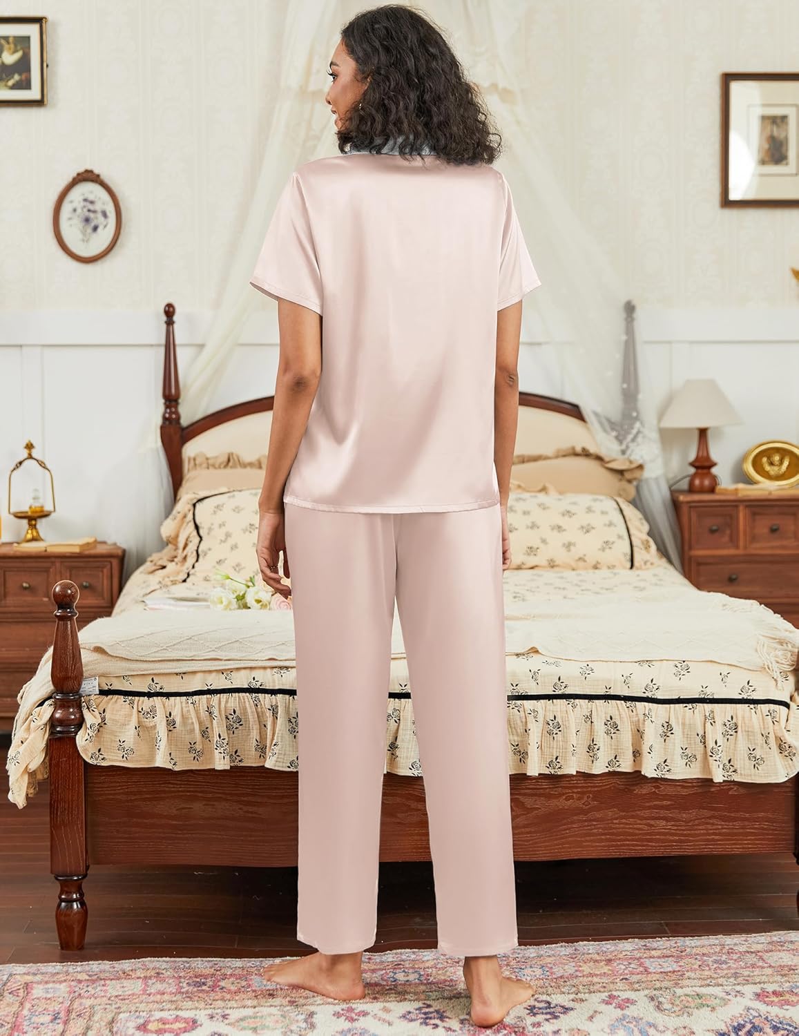 Satin pajama set in light pink with short-sleeve button-down top and matching straight pants
