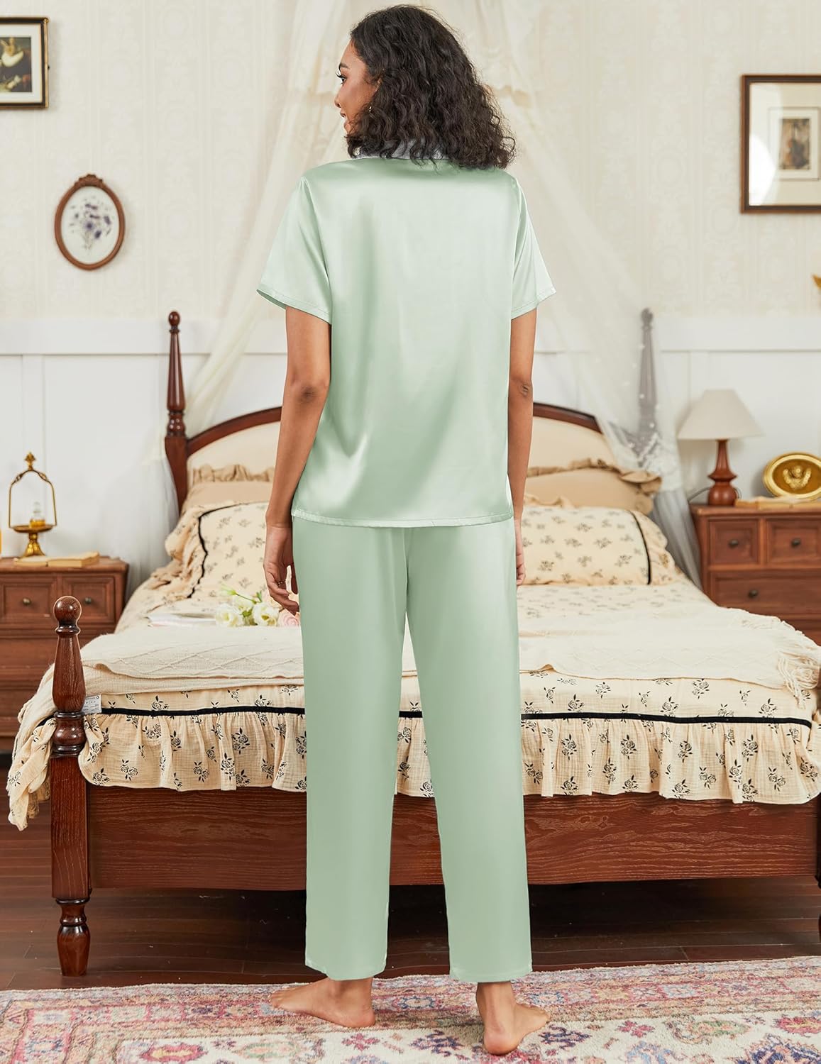 Satin pajama set in light green: back view of short-sleeve button top with wide-leg pants.