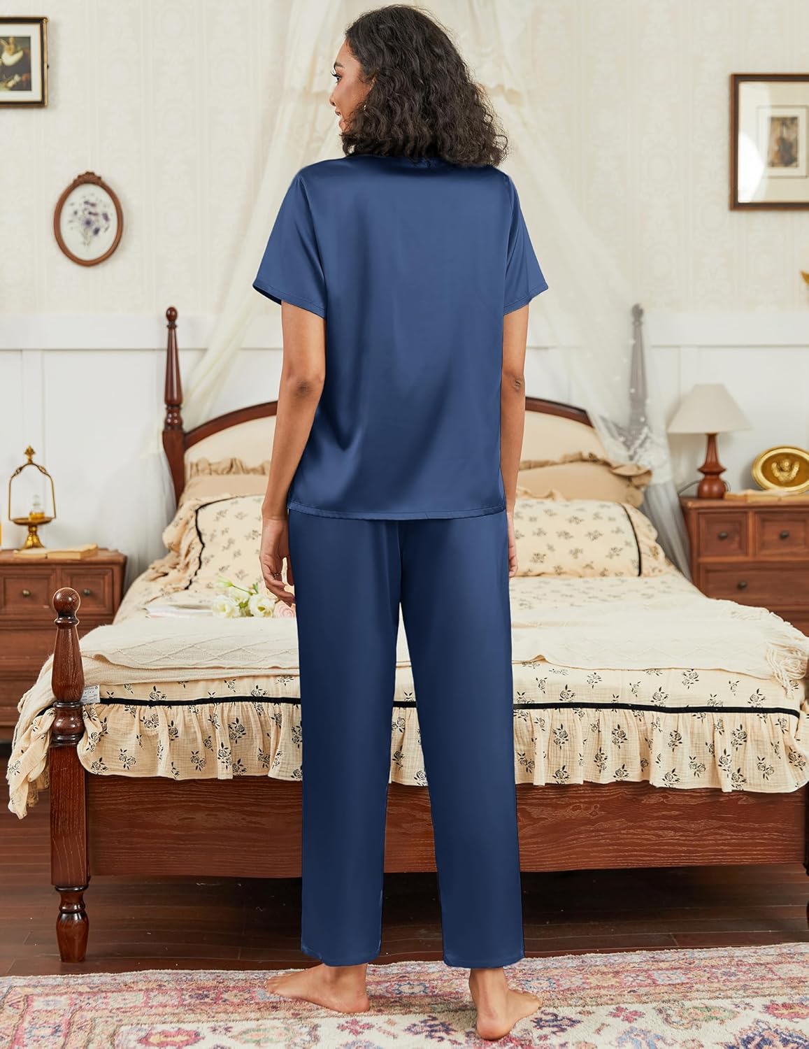 Satin pajama set in navy blue with short-sleeve button-down top and matching straight pants