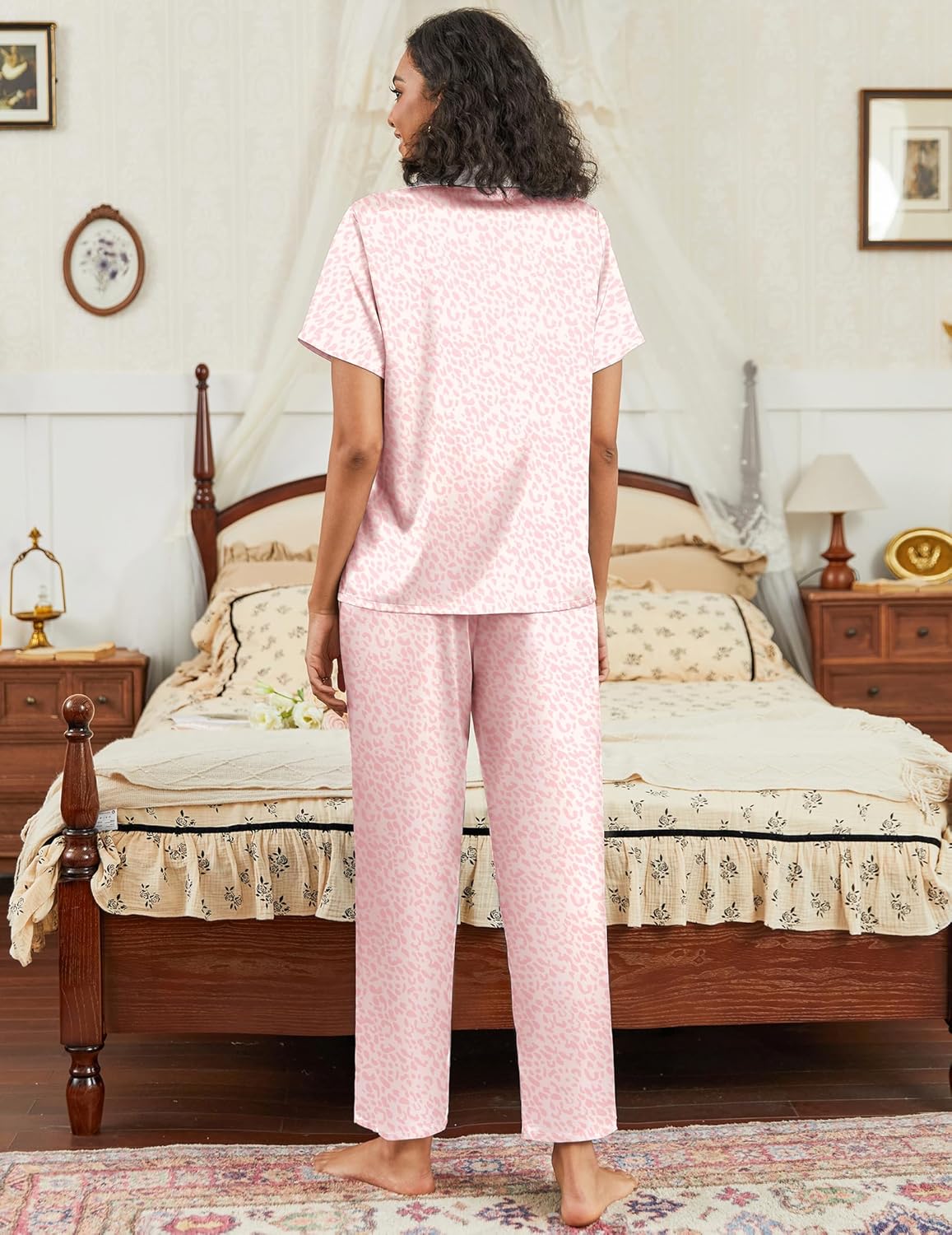 Satin pajama set in light pink with short-sleeve button-down top and matching straight pants
