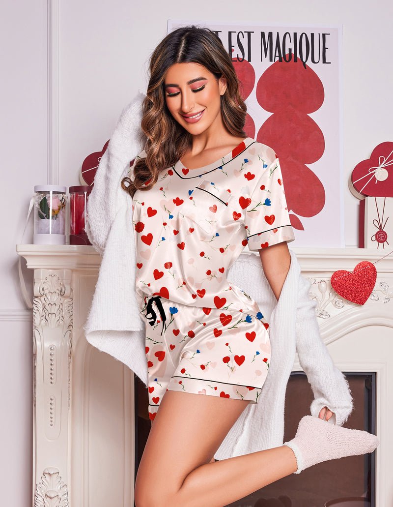 Heart-print pajama set with short sleeves and matching drawstring shorts, white base