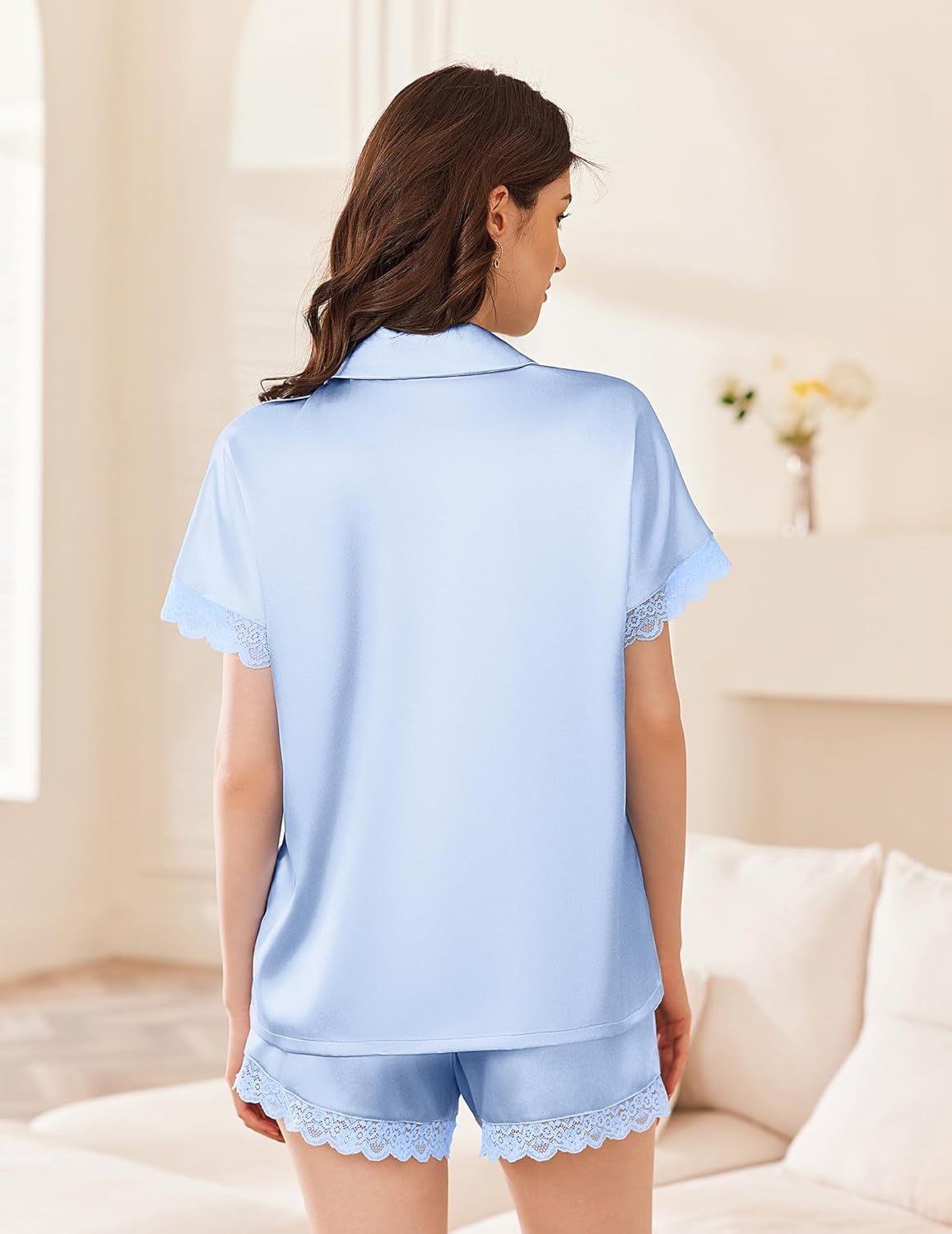 Light blue satin pajama set with short-sleeve button back and lace-trimmed shorts