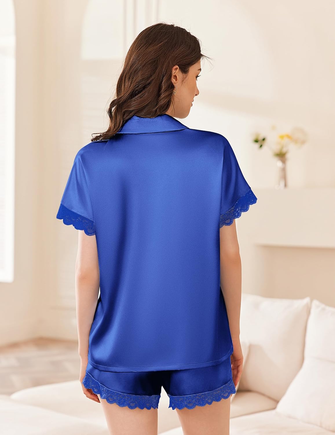 Bright blue satin pajama set with short-sleeve button back and lace-trimmed shorts