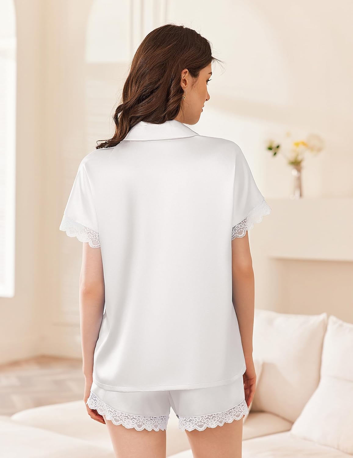 White satin pajama set with lace-trimmed short sleeves and lace hem shorts