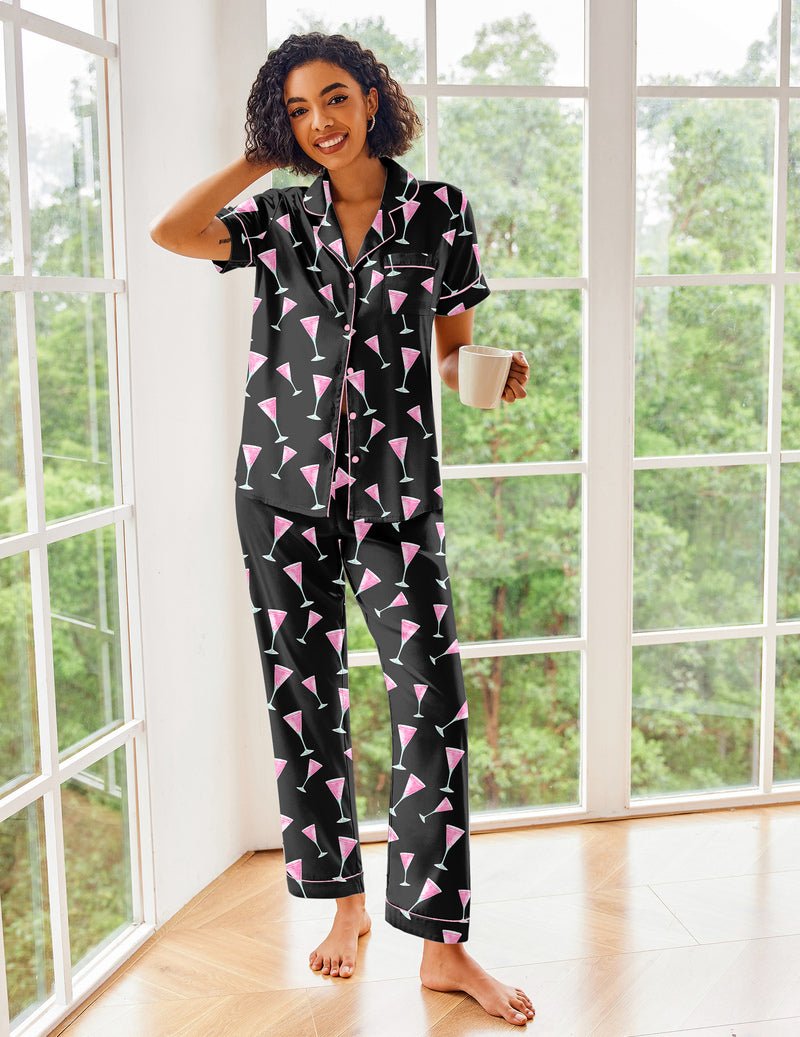 Black pajama set with pink graphic print, short sleeves, button front and ankle-length pants