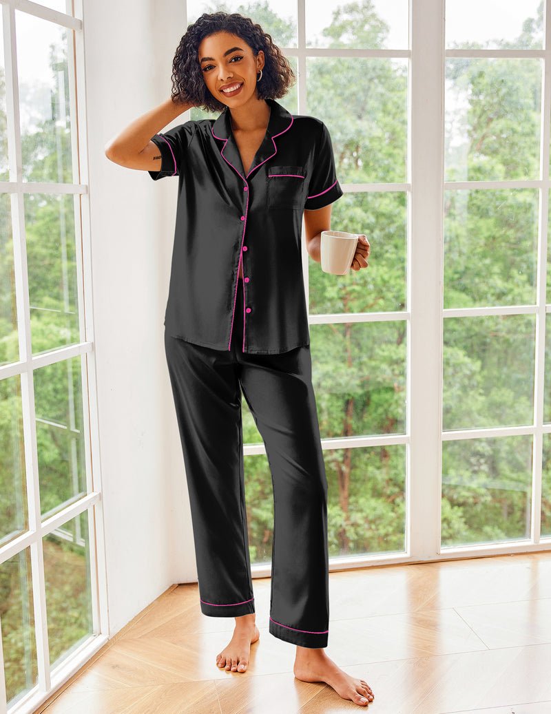 Black silk satin pajama set with pink piping, short-sleeve button top and pants