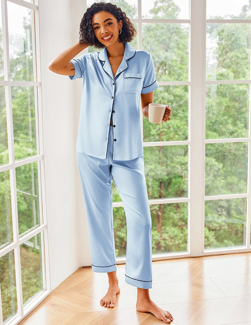 Silk satin pajama set in light blue: button-up shirt with pocket and ankle-length pants