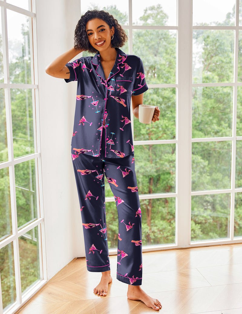 Navy satin pajama set with pink bow print, short sleeves, button front and pants
