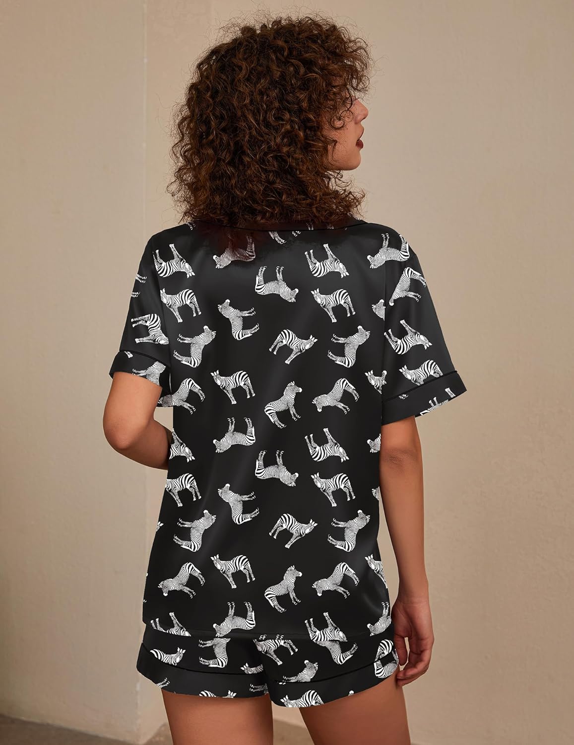 Silk pajama set, two-piece, black with white zebra print, back view of shorts set
