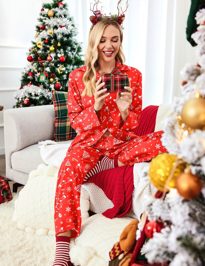 Red satin pajama set with festive print, button-front top and long pants with striped cuffs