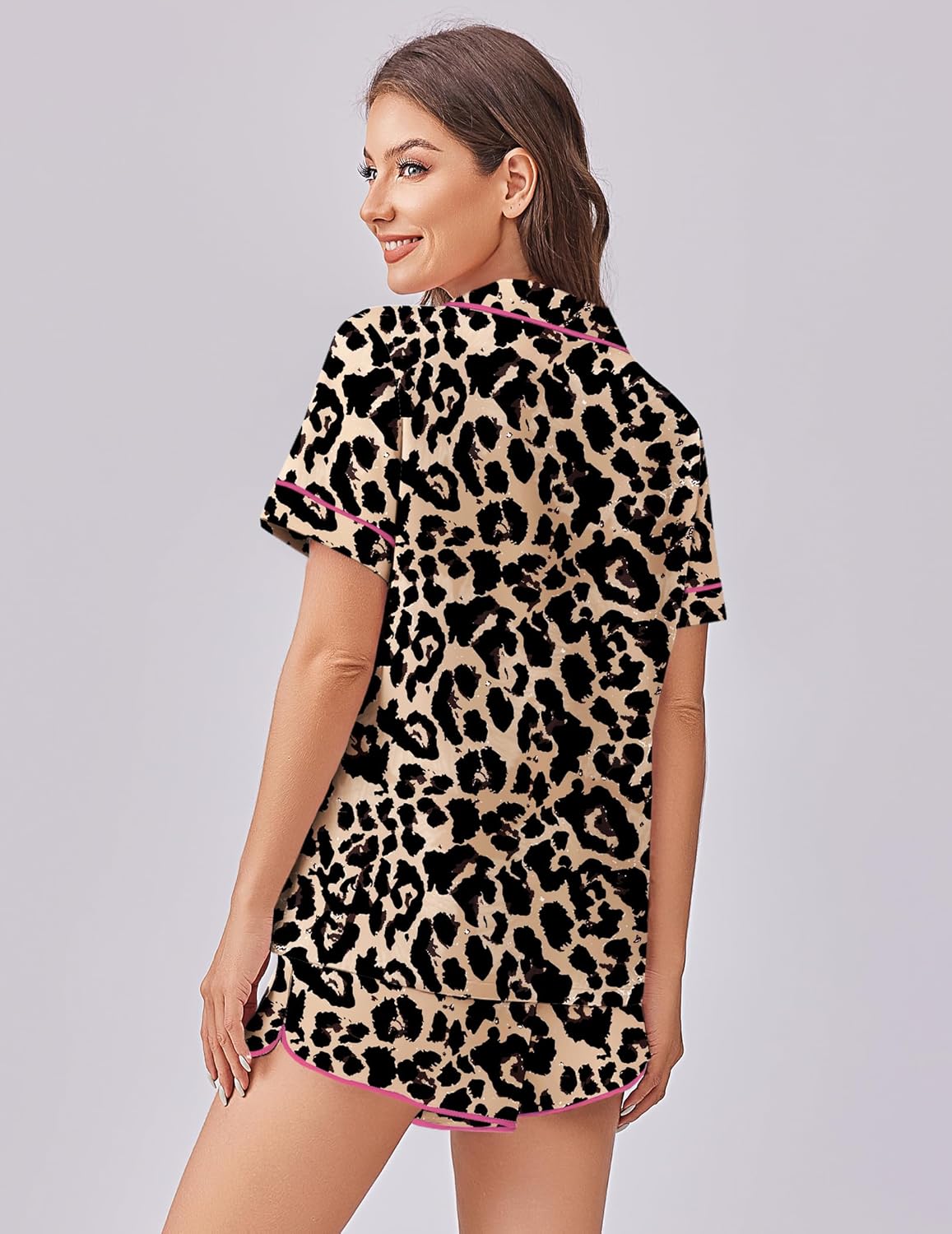 Back view leopard-print pajama set with short-sleeve button top and matching shorts, pink trim