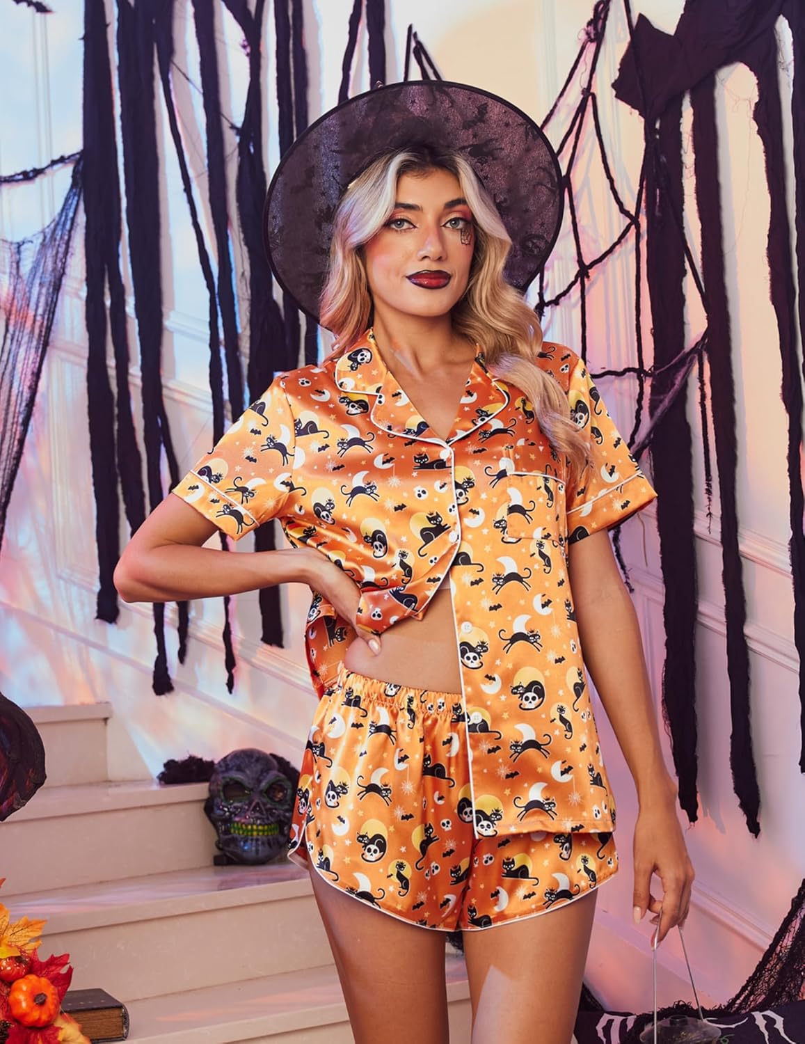 Orange Halloween skull pajama set, short-sleeve button-up top and shorts (front view)