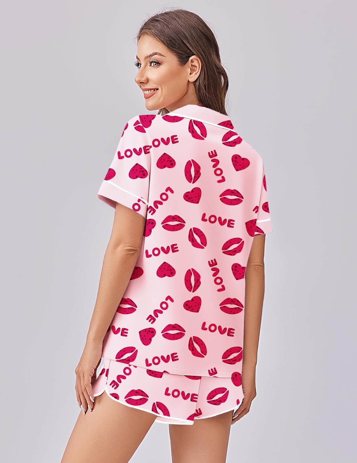 Pink satin pajama set with heart-and-lip print short-sleeve top and boxer shorts