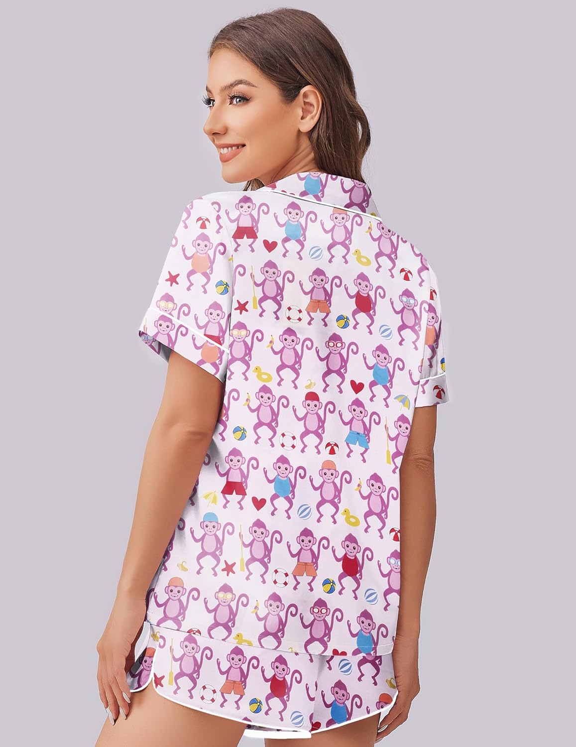 White pajama set with colorful monkey print, button-down top and matching shorts