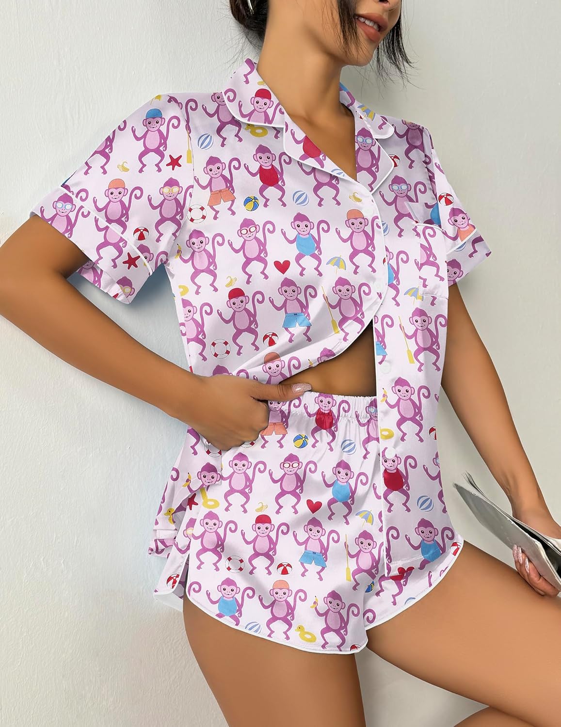 Monkey-print pajama set with short-sleeve button top and matching shorts, multicolor accents