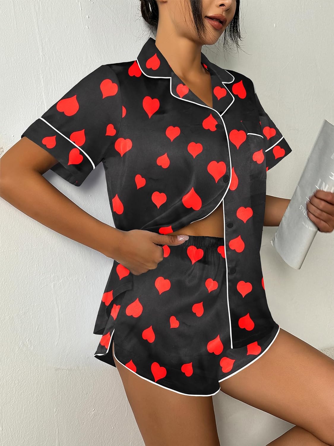 Silk-satin pajama set with black button-up shirt and red heart print shorts