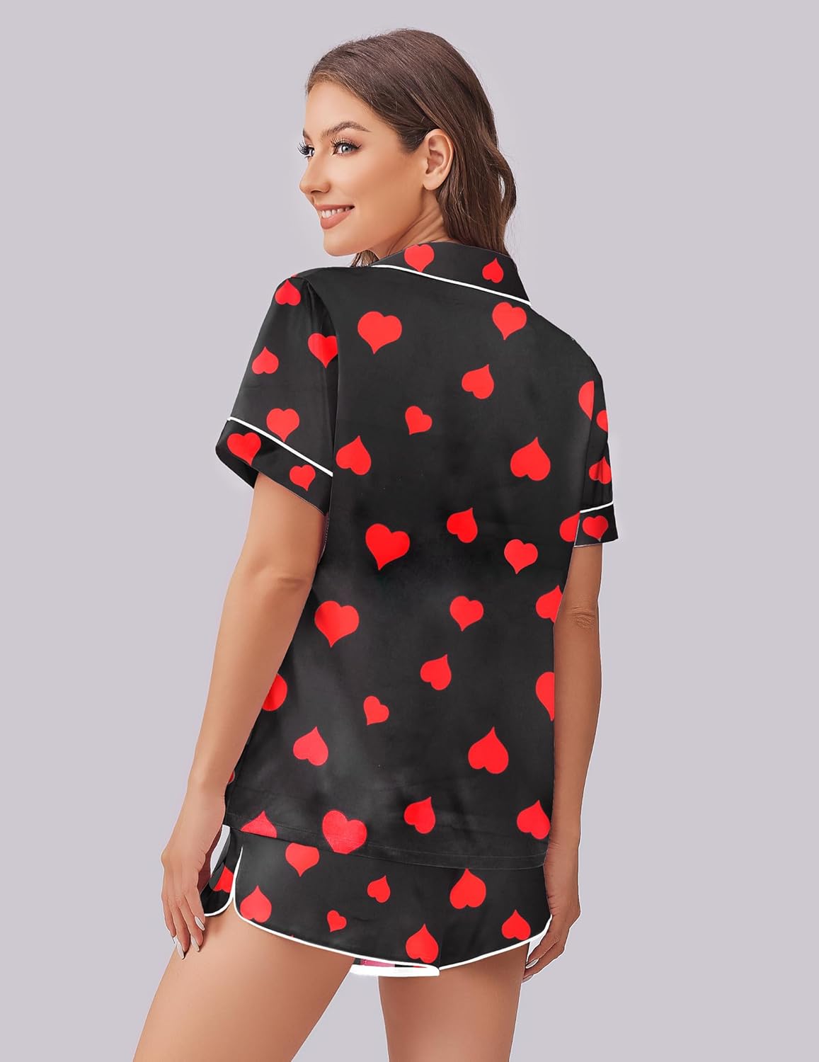 Silk-satin pajama set, back view: black top with red heart pattern and matching shorts
