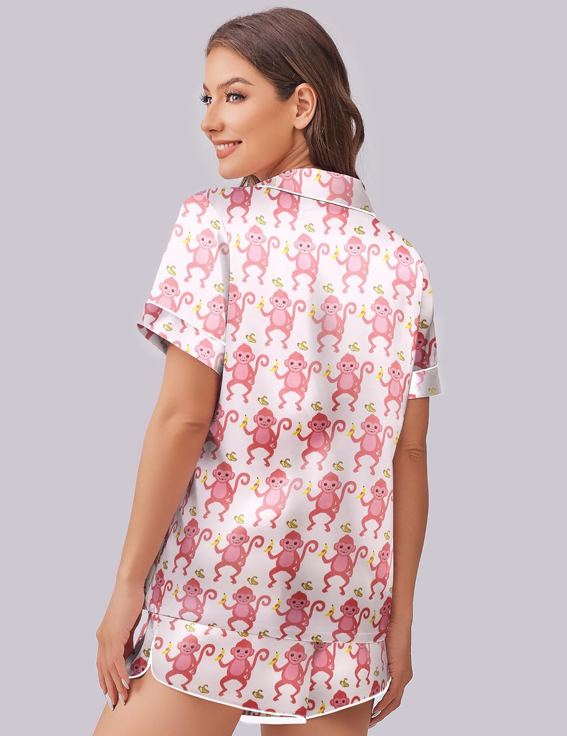 Silk-satin pajama set, back view: pink monkey print shirt and matching shorts