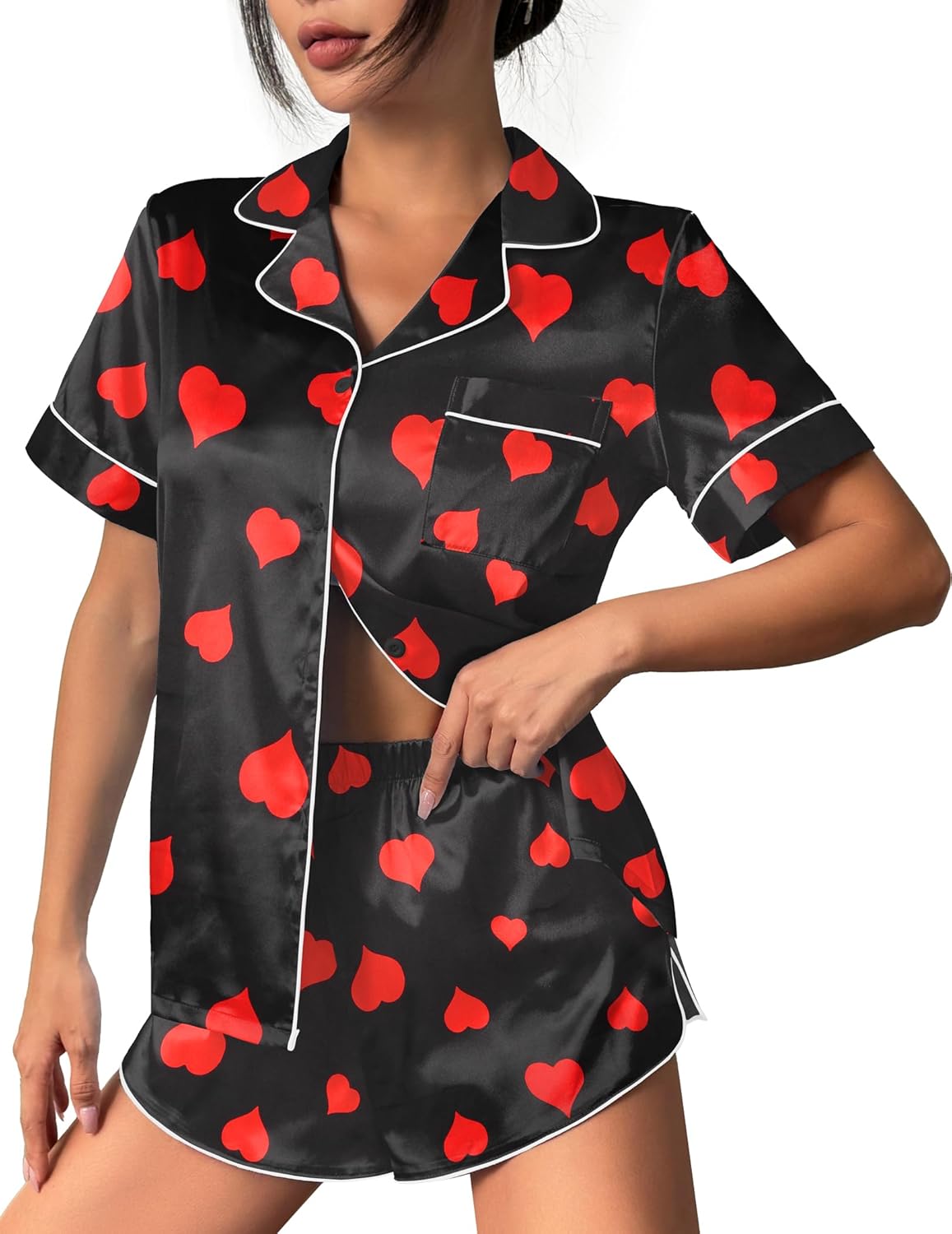 Black silk satin pajama set with red heart print, button-up top and matching shorts