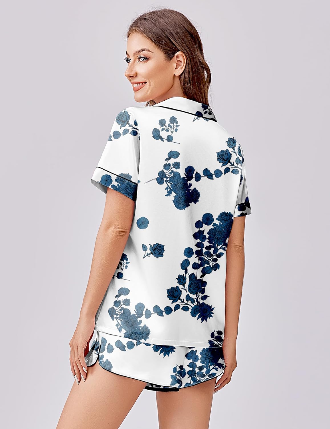 Silk-satin pajama set, back view: white top with blue floral print and matching shorts