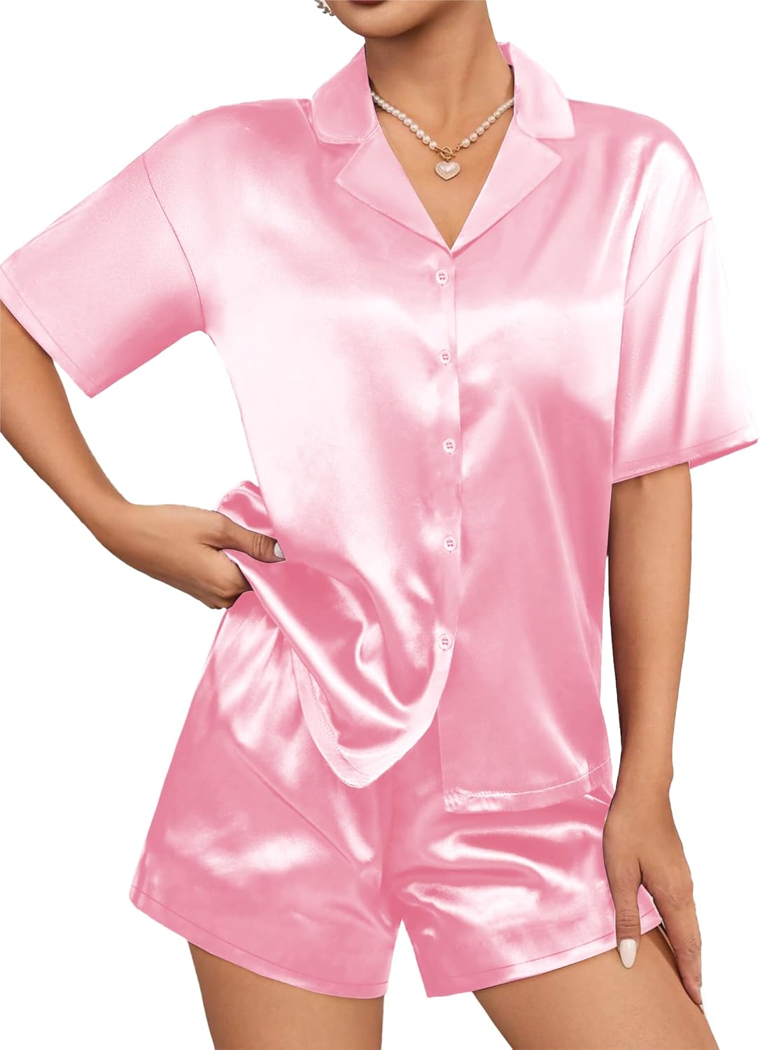 Pink satin short-sleeve pajama set with button-up shirt and matching shorts