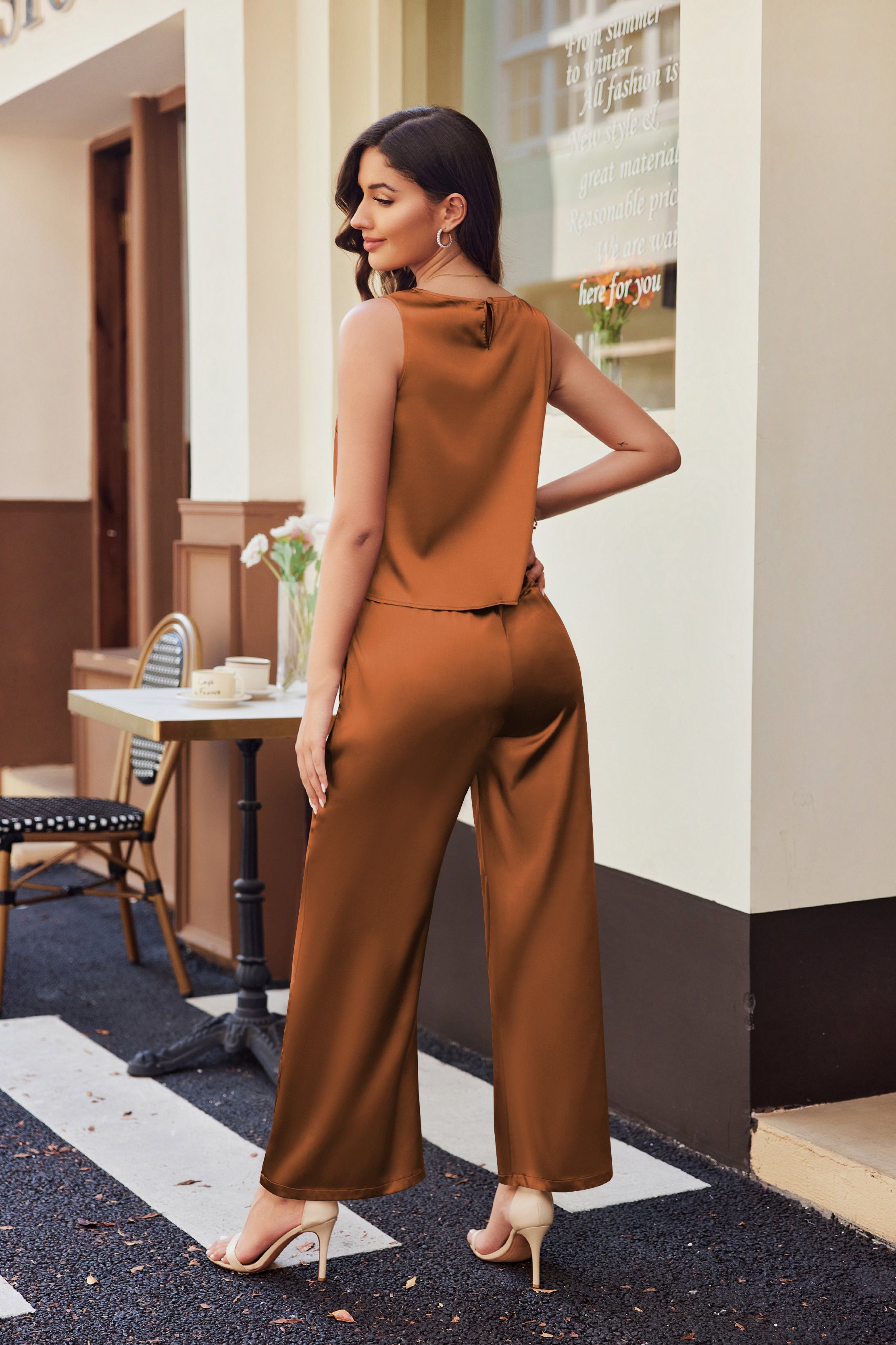 Brown sleeveless satin pajama set with wide-leg pants, shown from the back