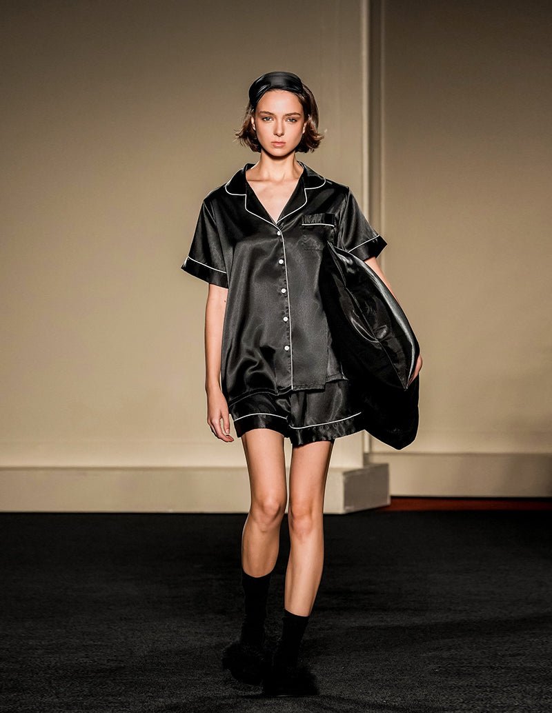 Black silk short pajama set: button-front short-sleeve top with chest pocket and matching shorts