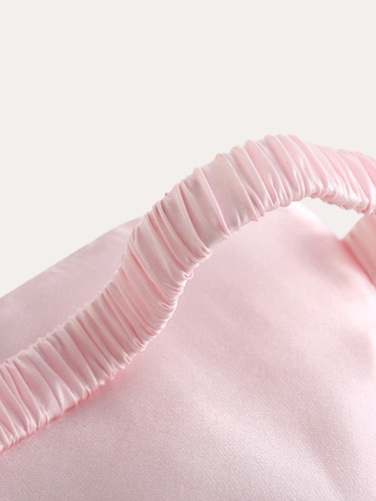 Pink satin sleep eye mask elastic trim close-up