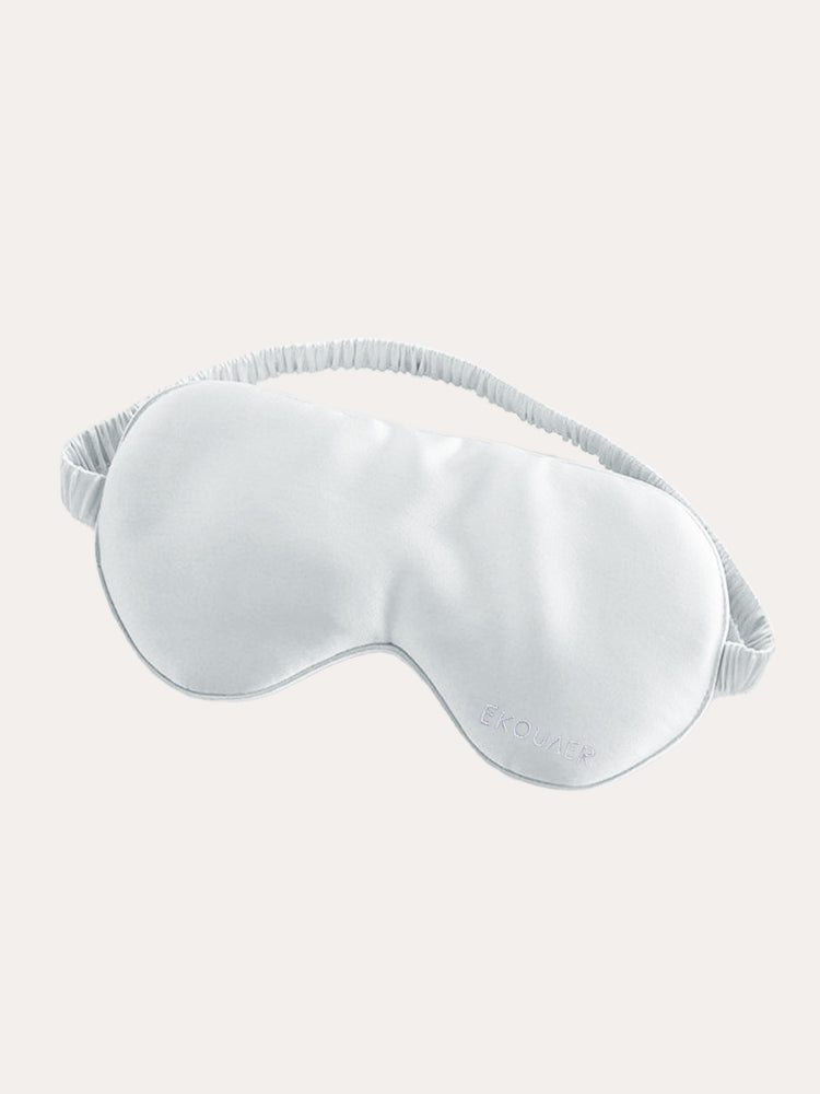 White satin sleep eye mask with curved eye shape and elastic strap