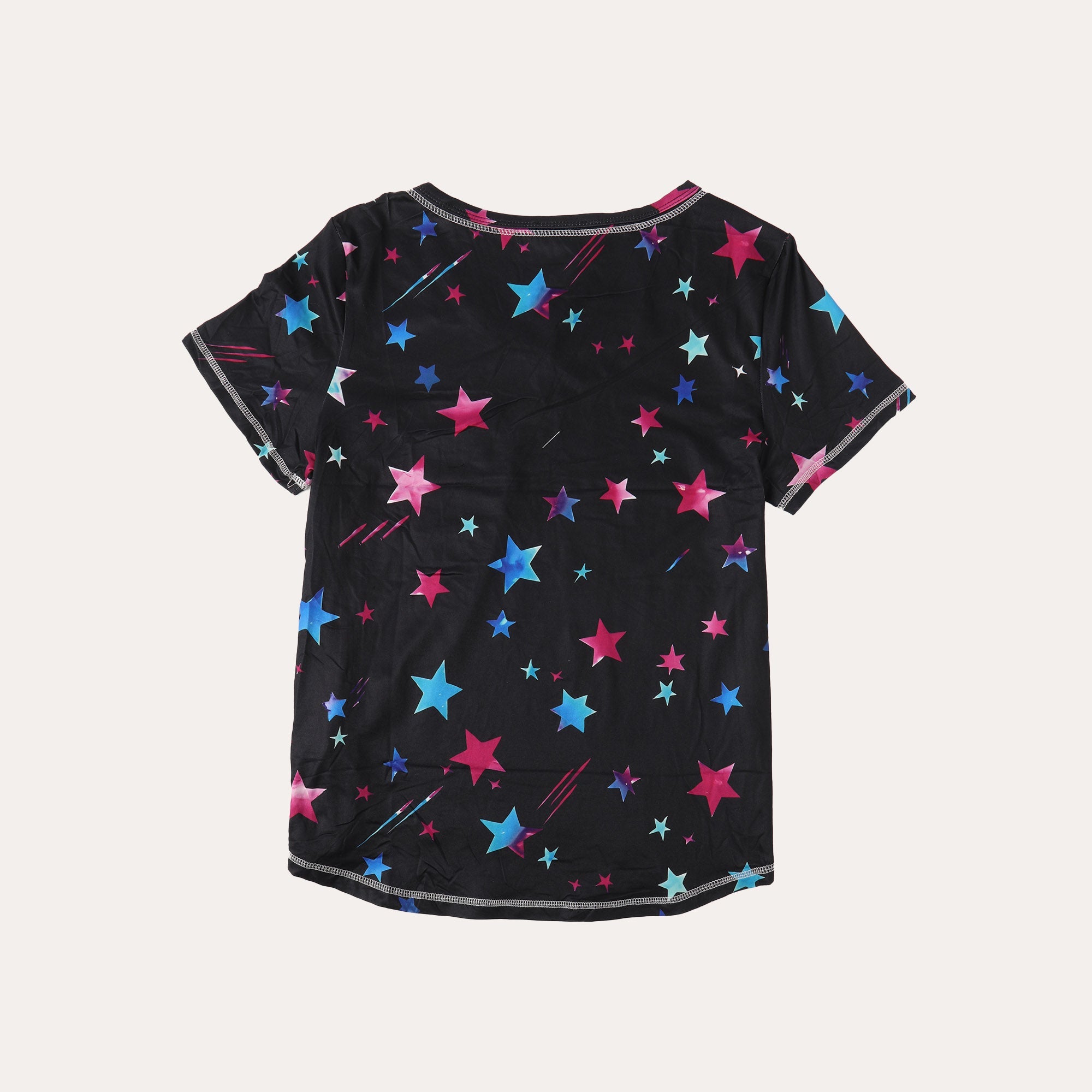 Black star-print T-shirt with scattered pink, blue, and teal stars
