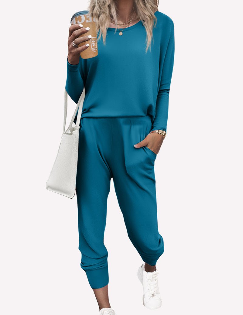 Blue-green pajama set, drapey long sleeves and tapered jogger pants with cuffs