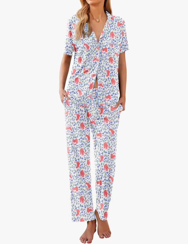 Pyjama set in white with colorful dog print, short-sleeve button shirt and long pants