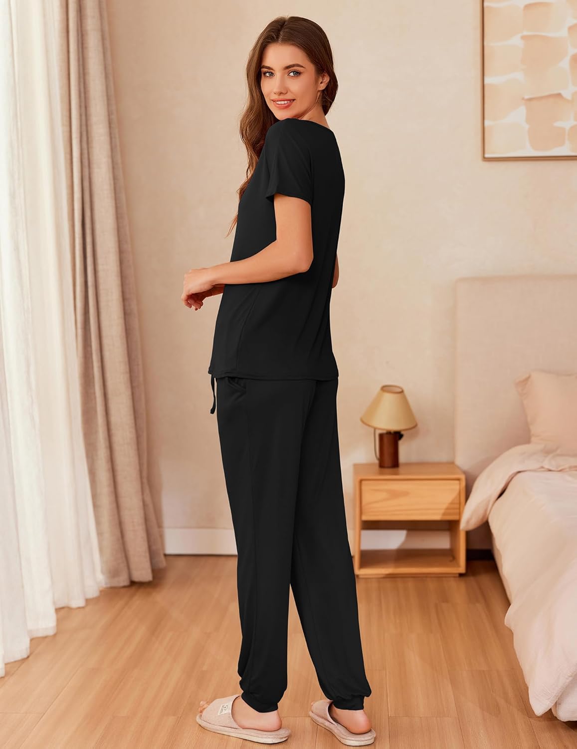 Black short-sleeve lounge set with long pants and drawstring details